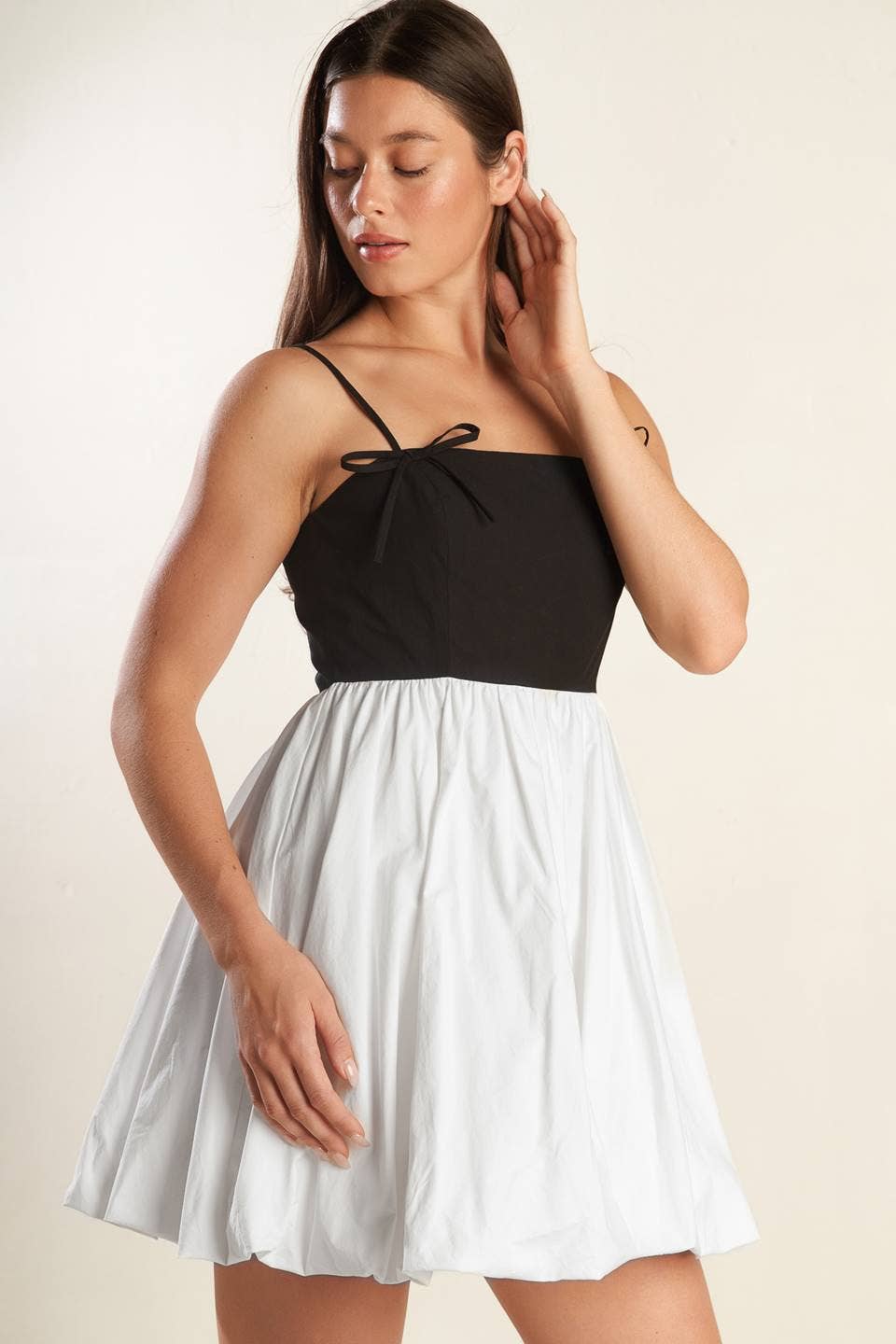 A solid knit woven combination mini dress