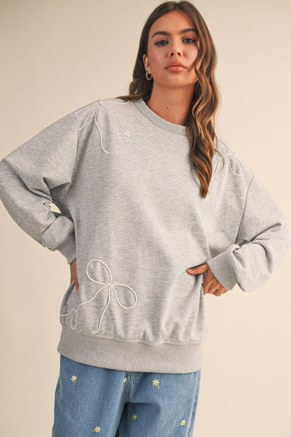 BOW APPLIQUÉ SWEATSHIRT
